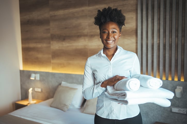 woman with fresh, folded towels