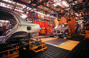 vehicles in a warehouse following current process controls