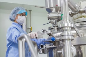 hospital worker operating a machine in a hospital setting 